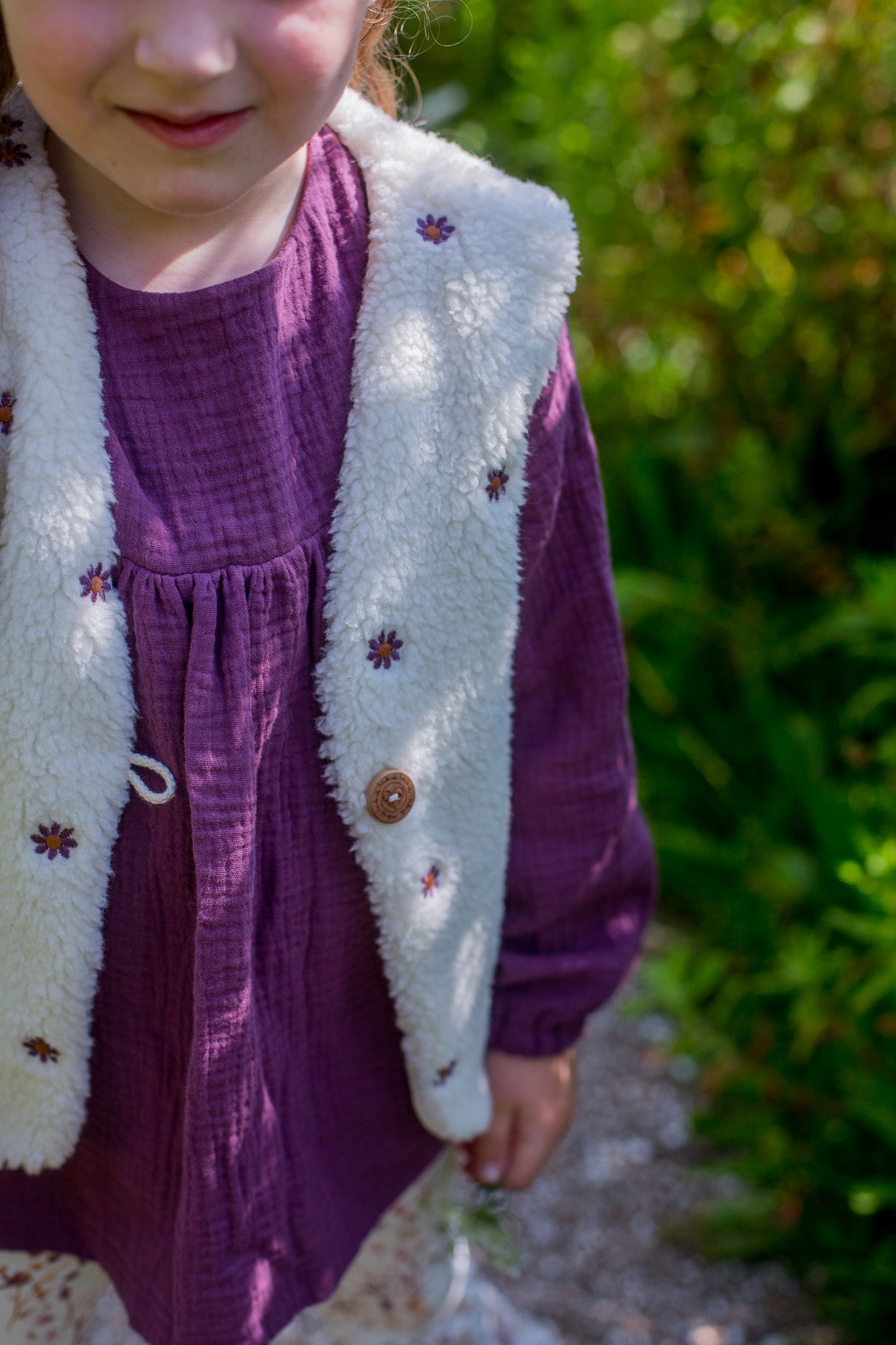 Gilet teddy geborduurde bloem