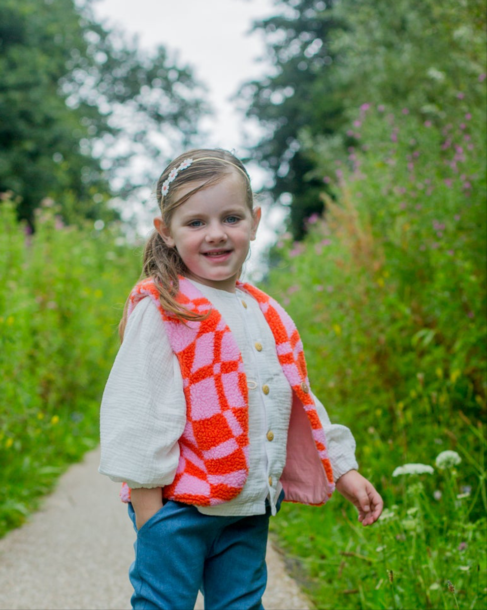 Gilet teddy graphic oranje/roze