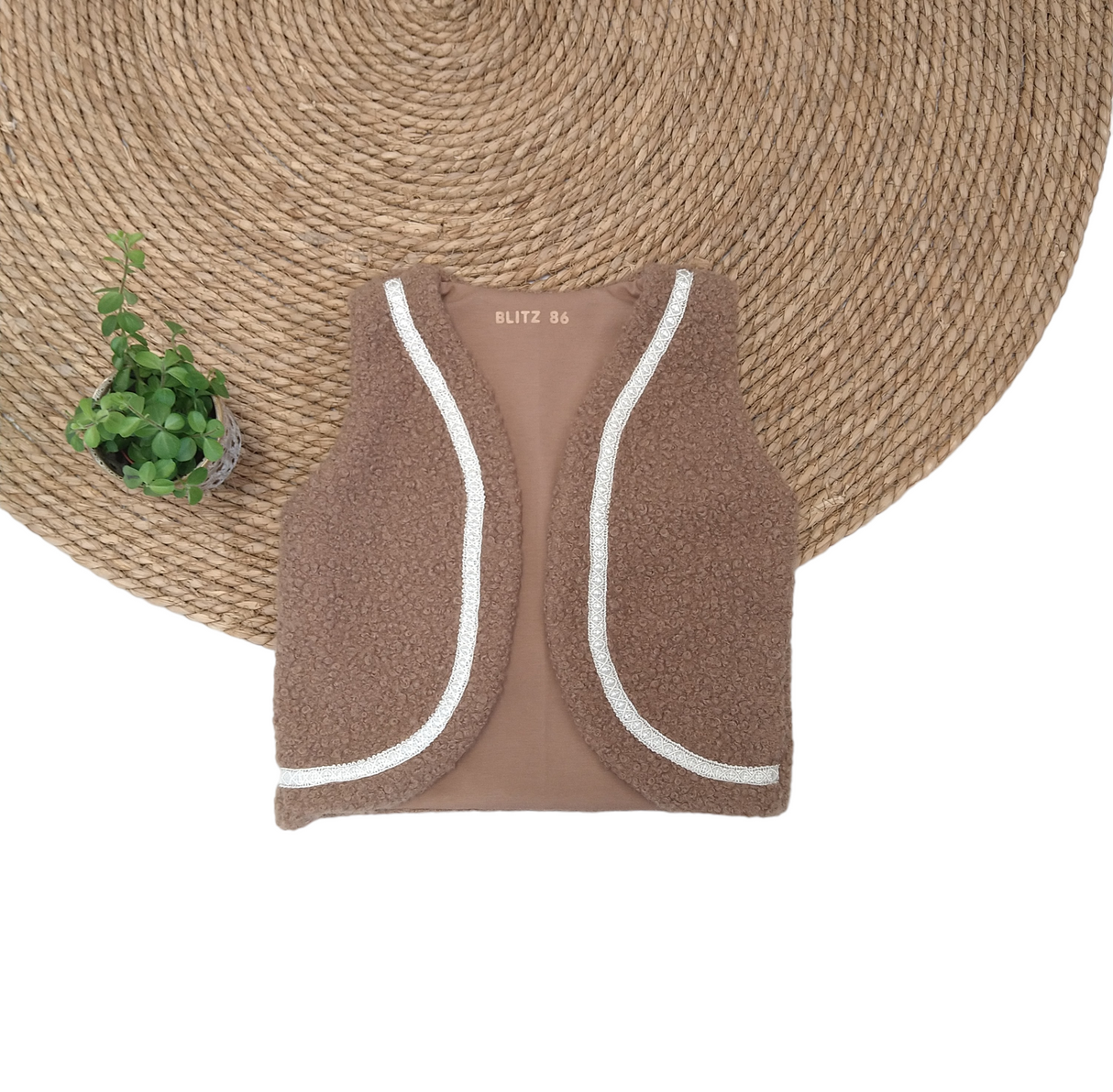 Gilet boucle met sierband