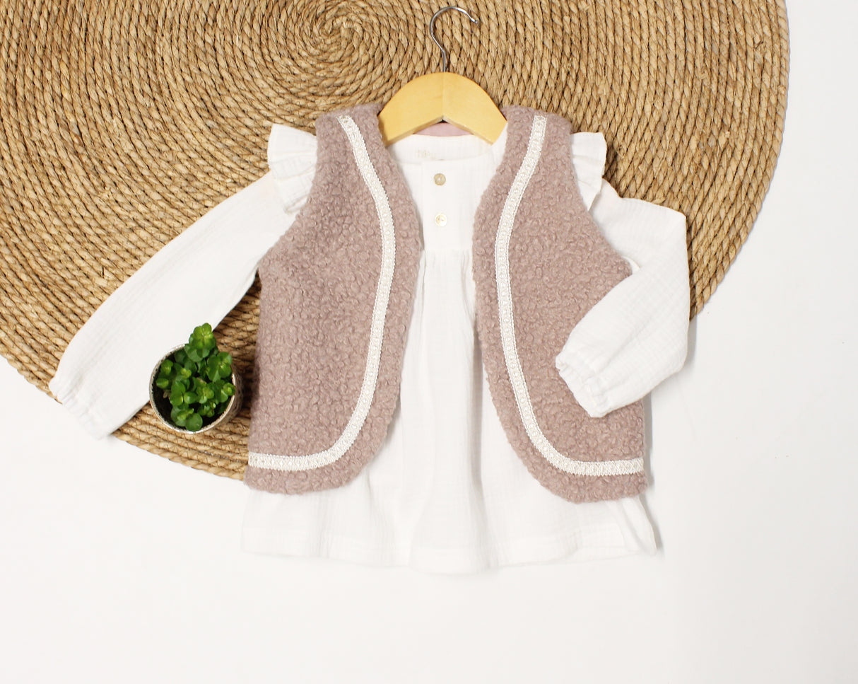 Gilet boucle met sierband